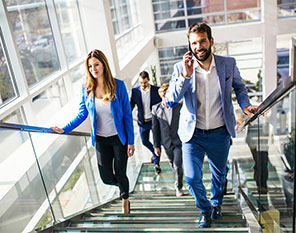 People walking up office stairs together