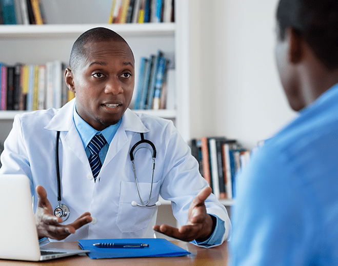 Doctor speaking with patient during consultation