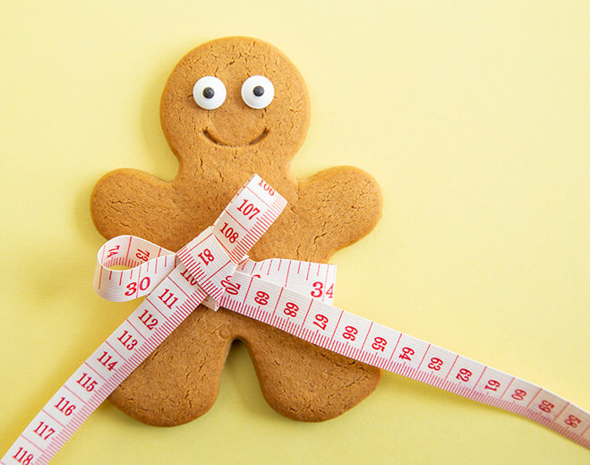 Gingerbread cookie with measuring tape