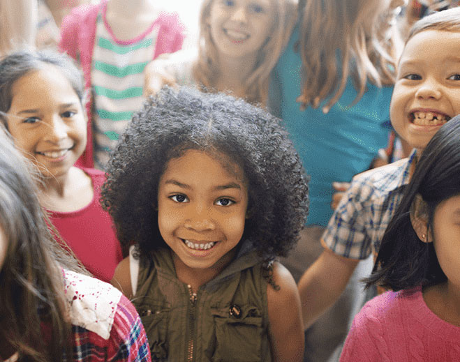 Group of children standing and smiling