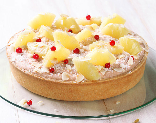 Pineapple tart with coconut and berries