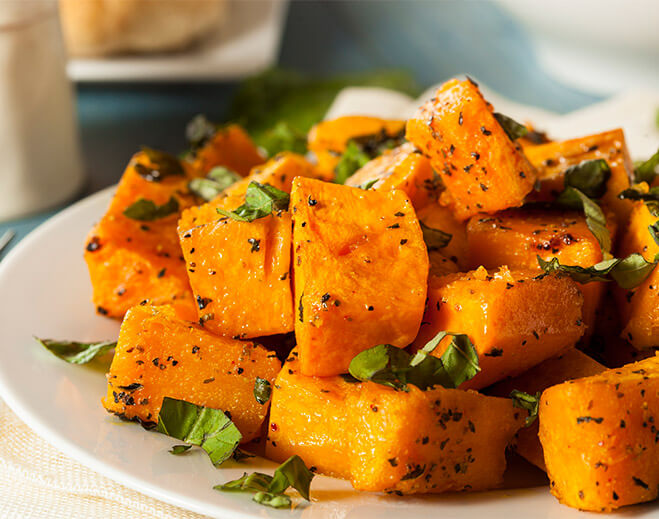 Roasted sweet potato cubes with herbs
