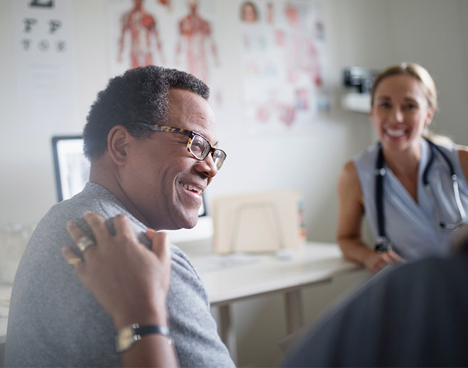Patient discussing care with clinician in office