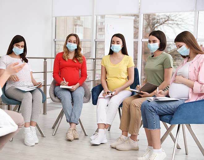 Pregnant patients attending group counseling session