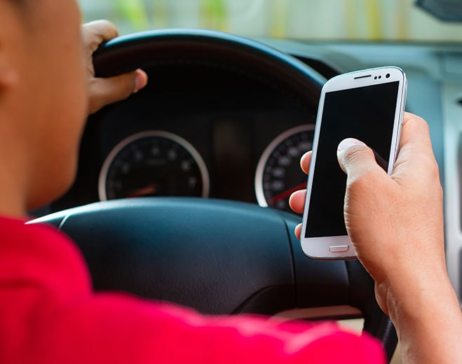 Person using phone while driving