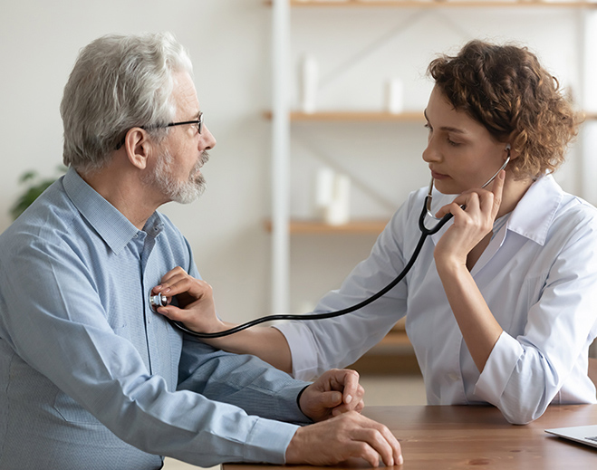 Clinician checking patient with stethoscope