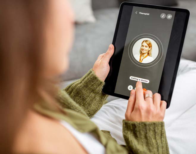 Person using tablet for virtual doctor visit