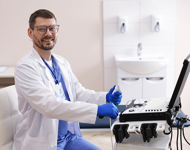 Clinician using ultrasound machine in exam room