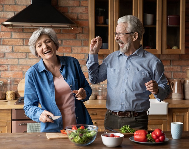 People preparing breakfast in kitchen
