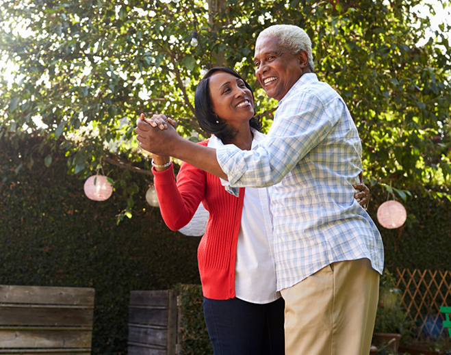 Two people walking outdoors in park