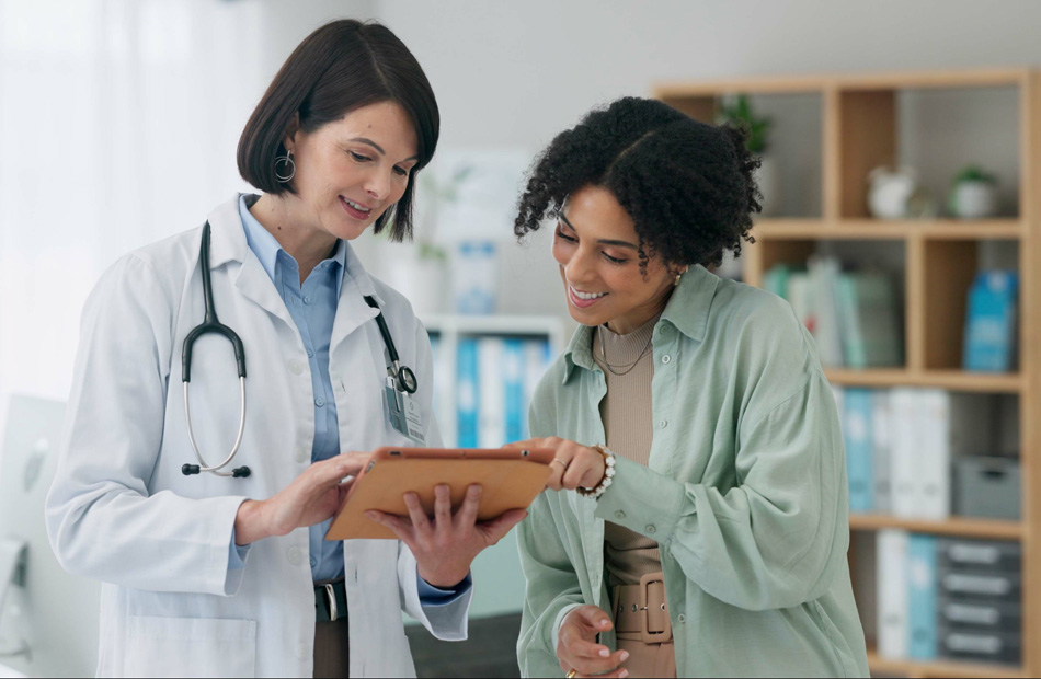 Doctor and patient looking at information on a tablet