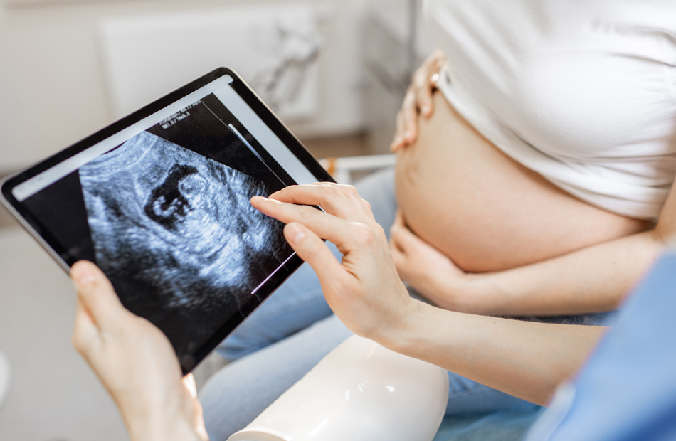 Doctor reviewing ultrasound image with patient