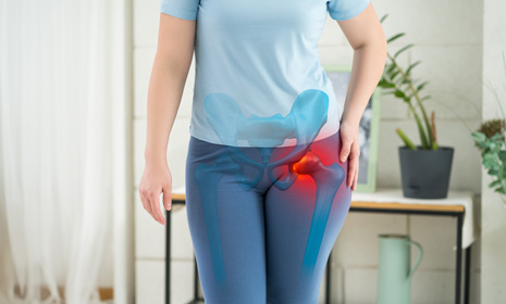 Person experiencing highlighted hip pain
