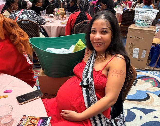 04 Pregnant person seated at baby shower
