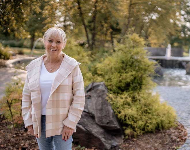 Heather standing near garden and fountain