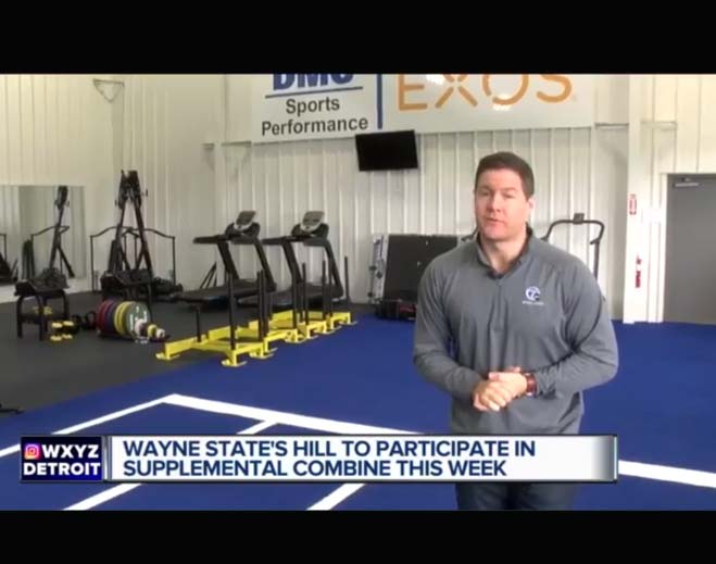 Man speaking in sports performance gym