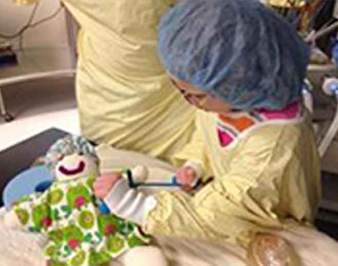 Pediatric patient playing with medical toy