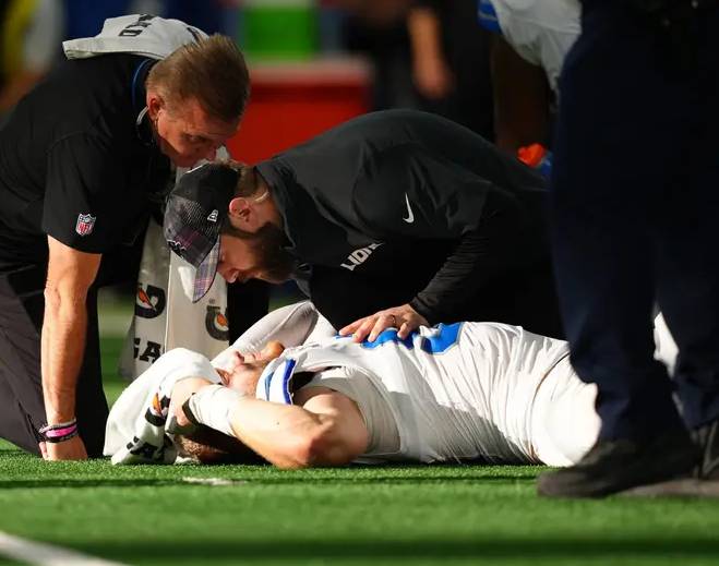 Football player receiving medical attention