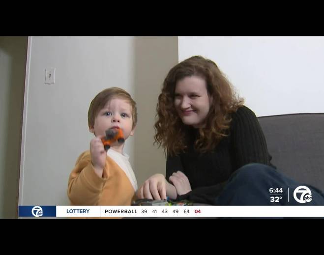 Child playing with parent at home