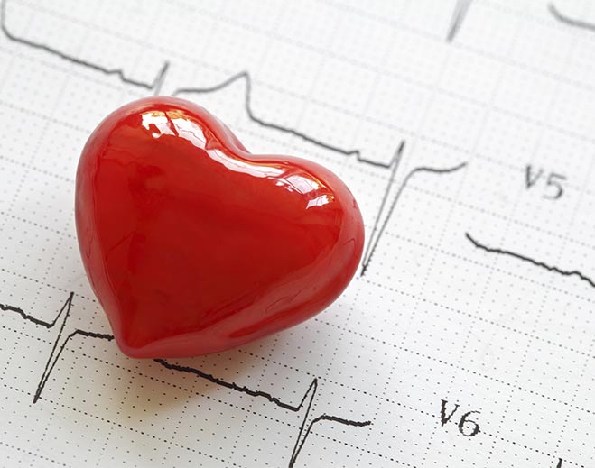 Red heart on ECG line illustration