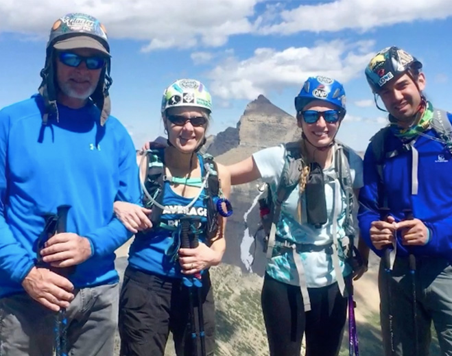 Hikers posing on mountain trail