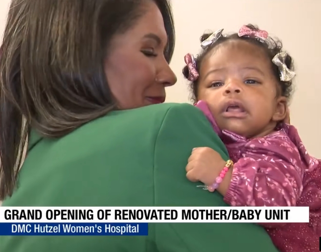 Mother holding baby at hospital