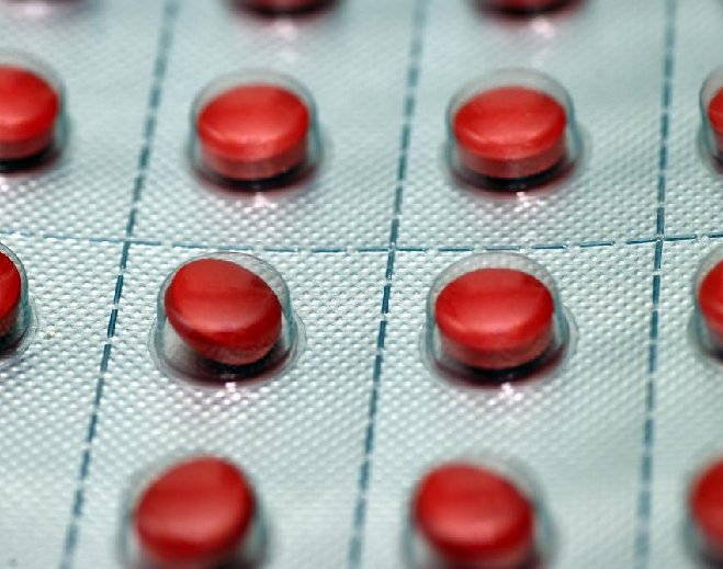 Red prescription pills in blister pack