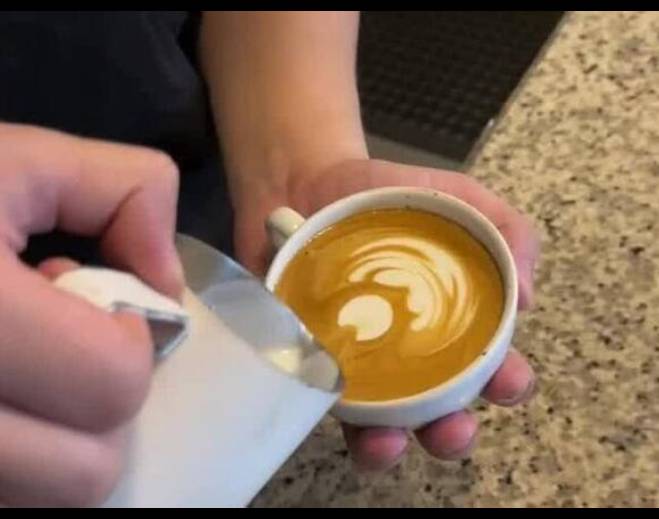 Coffee latte art closeup preparation