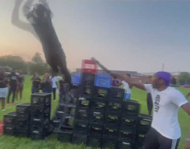 Man jumping an obstacle at outdoor event