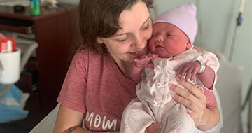 Kayla holding her baby