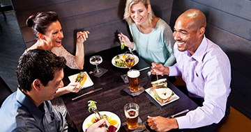 Group enjoying healthy meal at restaurant