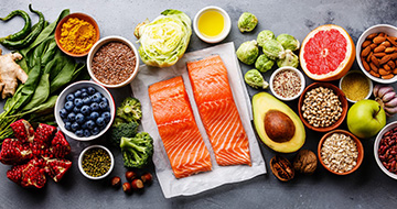 Assorted healthy foods with salmon and vegetables