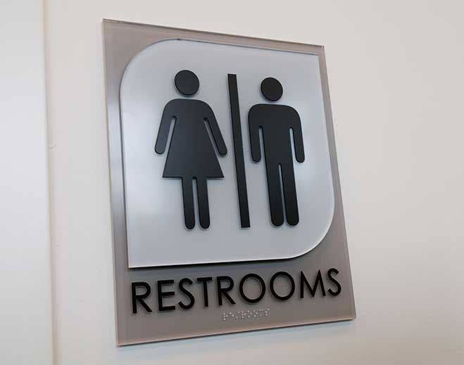Restroom sign with male and female icons