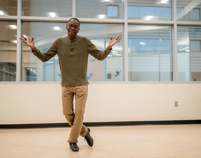 Otis dancing in bright indoor studio