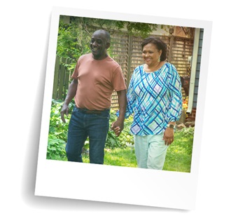 Couple walking outdoors in garden