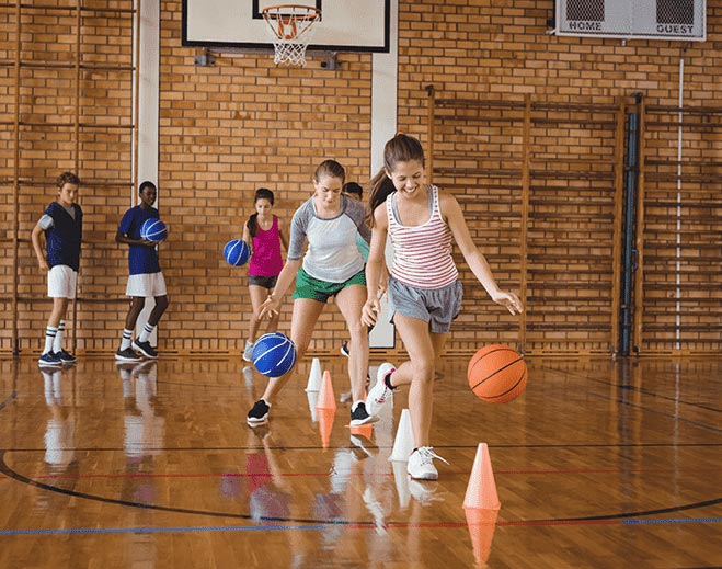 kids dribbling a ball