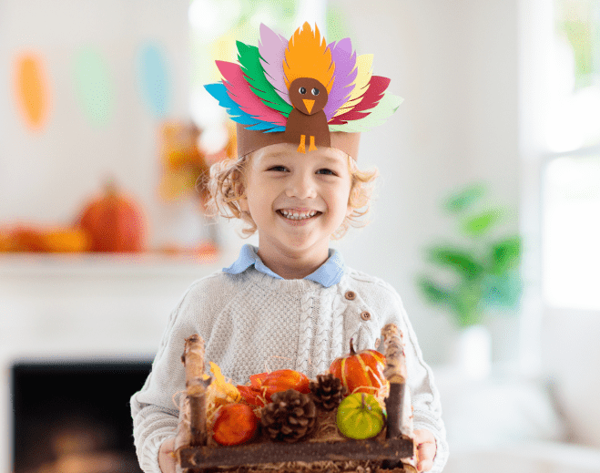 child with a turkey hat on
