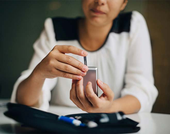 woman taking glucose test