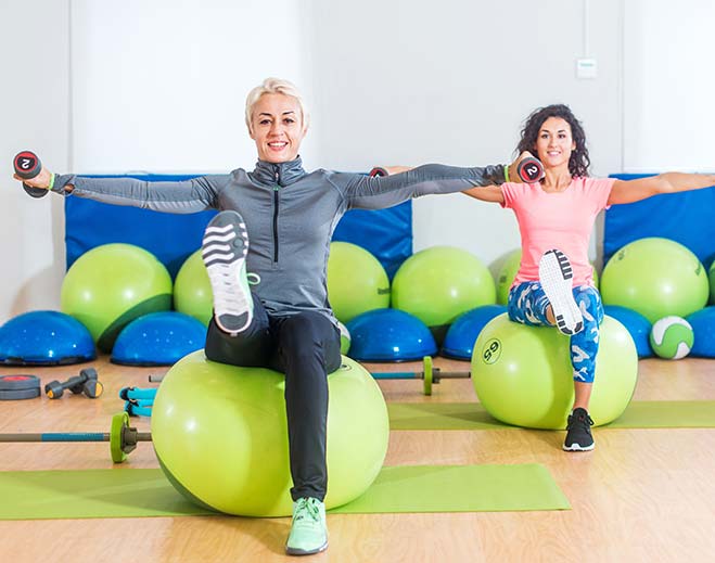 women on exercise balls