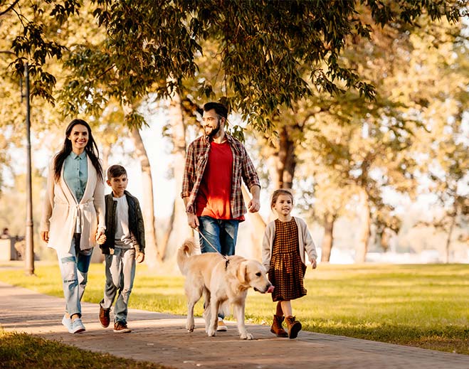 family taking a walk in the park